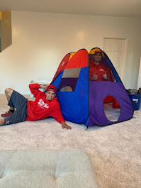 Budget Movers crew setting up a child's play tent after a move