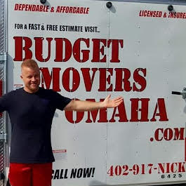Budget Movers crew member in front of the branded Omaha truck