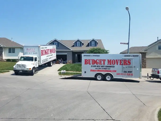 Budget Movers truck and trailer parked at a residential move in Omaha