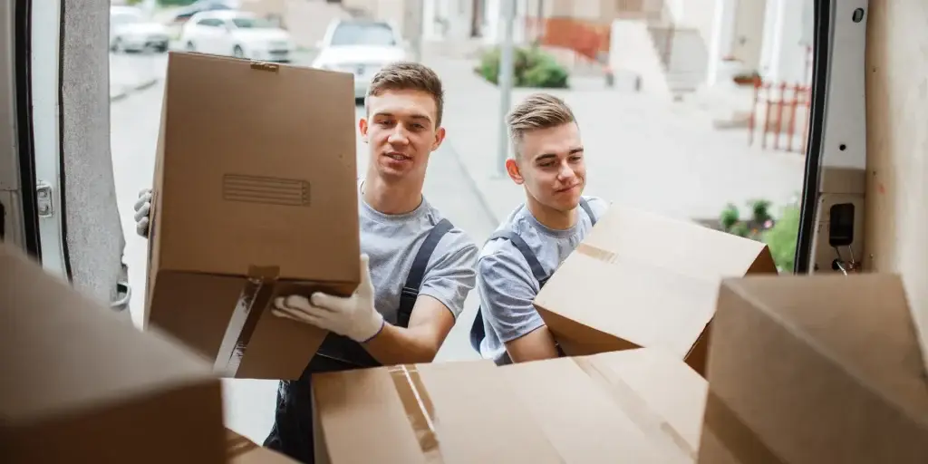 Budget Movers team loading boxes into the moving truck