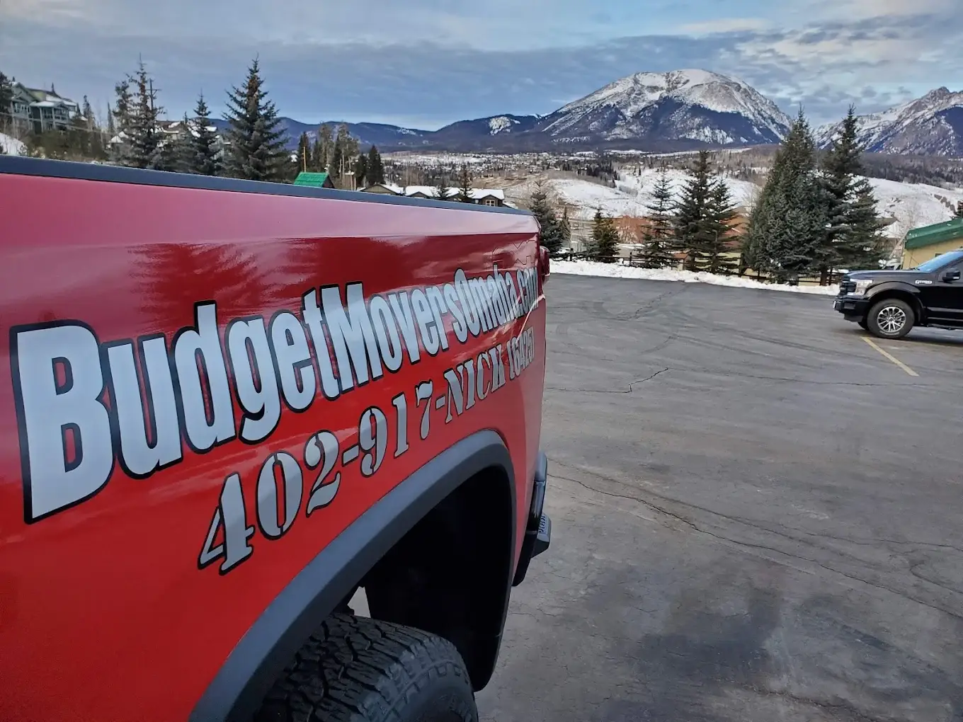 Budget Movers red truck with mountain backdrop on a long-distance move